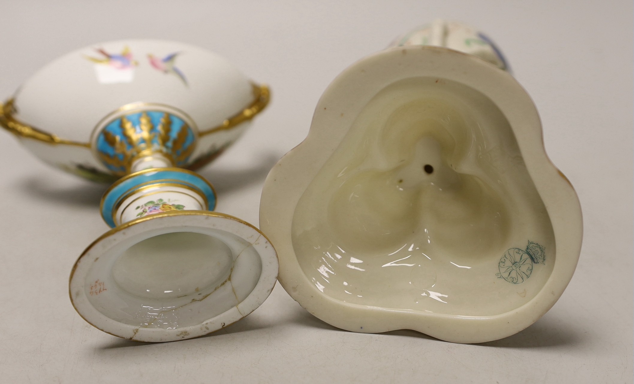 A Royal Worcester urn, modelled as three birds legs holding an oviform vase and a Royal Crown Derby two handled urn and cover on stand, Worcester urn 17cms high